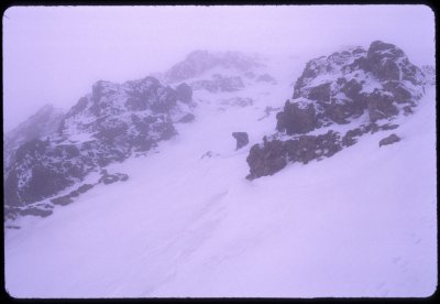 Cyril makes a ski turn through the crux of the Cooper Spur